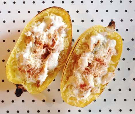 Completed spaghetti squash topped with oven baked chicken and Alfredo sauce. 